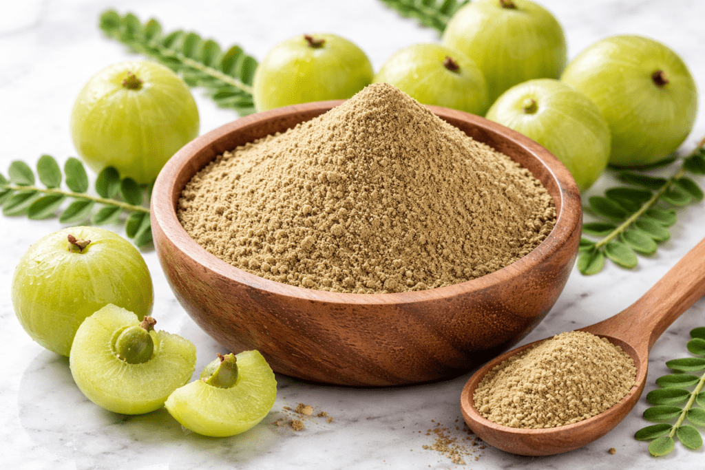"Amla powder in a bowl with fresh amla fruits showing herbal supplement benefits”